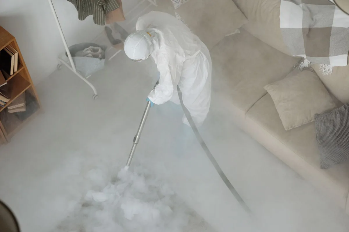 Biohazard cleanup technician in protective equipment, Somers, CT